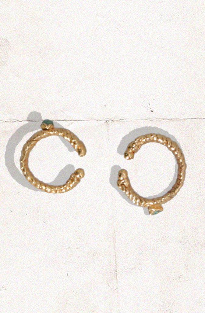 Altair EarcuffEarringsSet of 2 ear cuffs made from gold plated raffia with an intricate emerald stone in the centre. Can be positioned anywhere along the ear and look really great with ouGlobalistinaAltair EarcuffGlobalistina