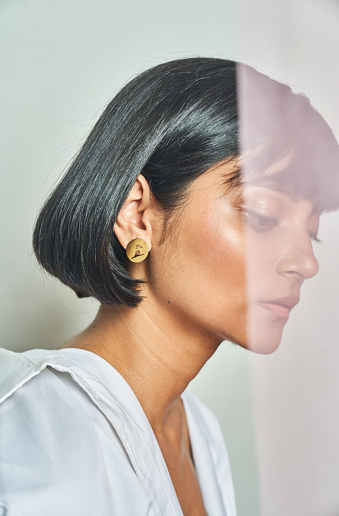 Badaal Cutout StudsEarringsThese cutout studs are part of a collection which serves as a reminder of the values that the various marks of Nepal represent. Evoking thought and zen of detachmentGlobalistinaBadaal Cutout StudsGlobalistina