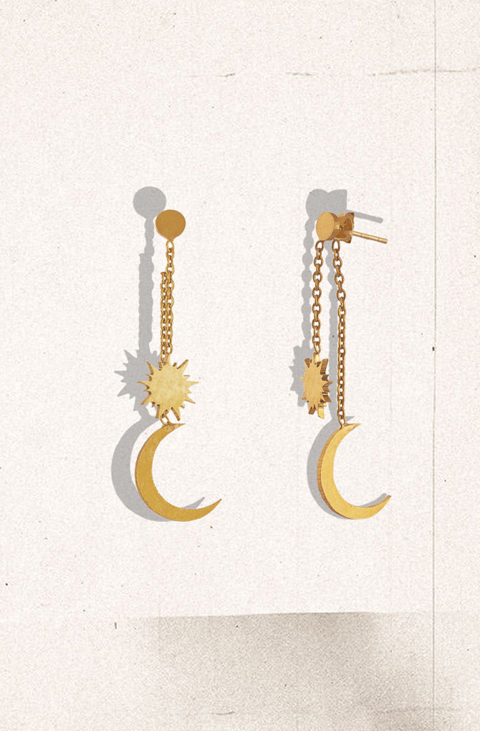 Chindra Surya EarringsEarringsAdorning the midnight sky, chandra (moon) and surya (sun) are symbols that resonate with everyone in Nepal and across the globe. Contemporary and light, these dangliGlobalistinaChindra Surya EarringsGlobalistina