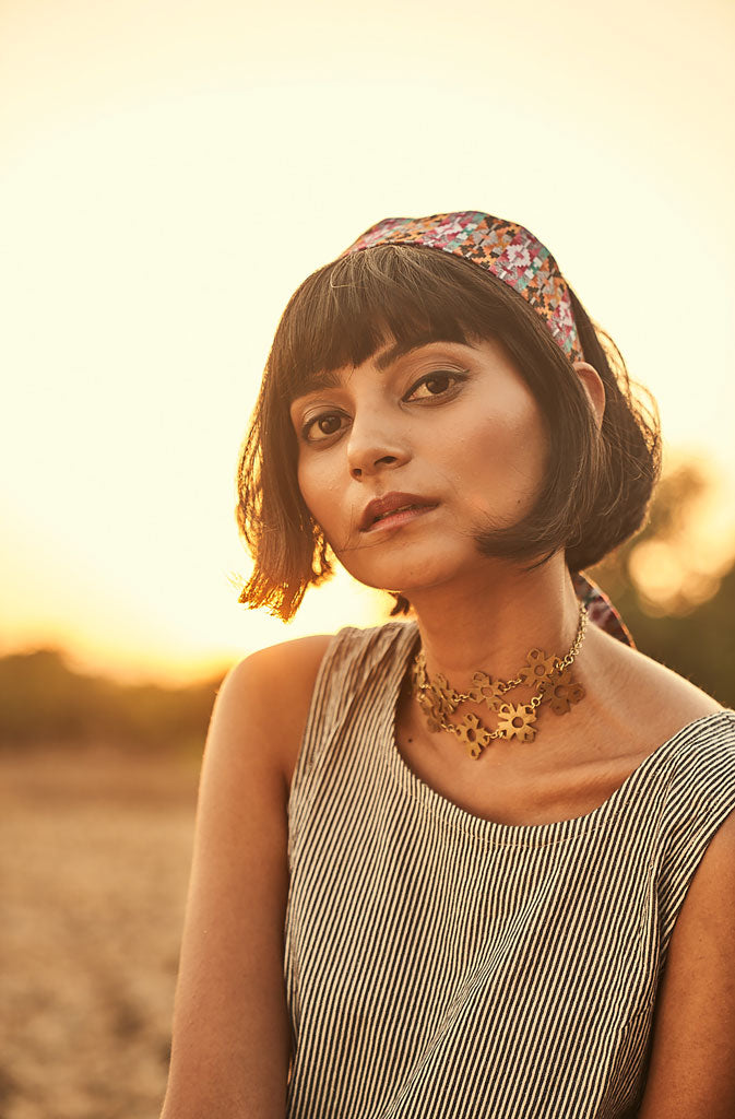 Festoon ChokerNecklaceThis piece is a reflection of the sanguineness and hope of its craftswomen through the festoon of flowers. Skilled artisans who are deaf and mute or survivors of humGlobalistinaFestoon ChokerGlobalistina