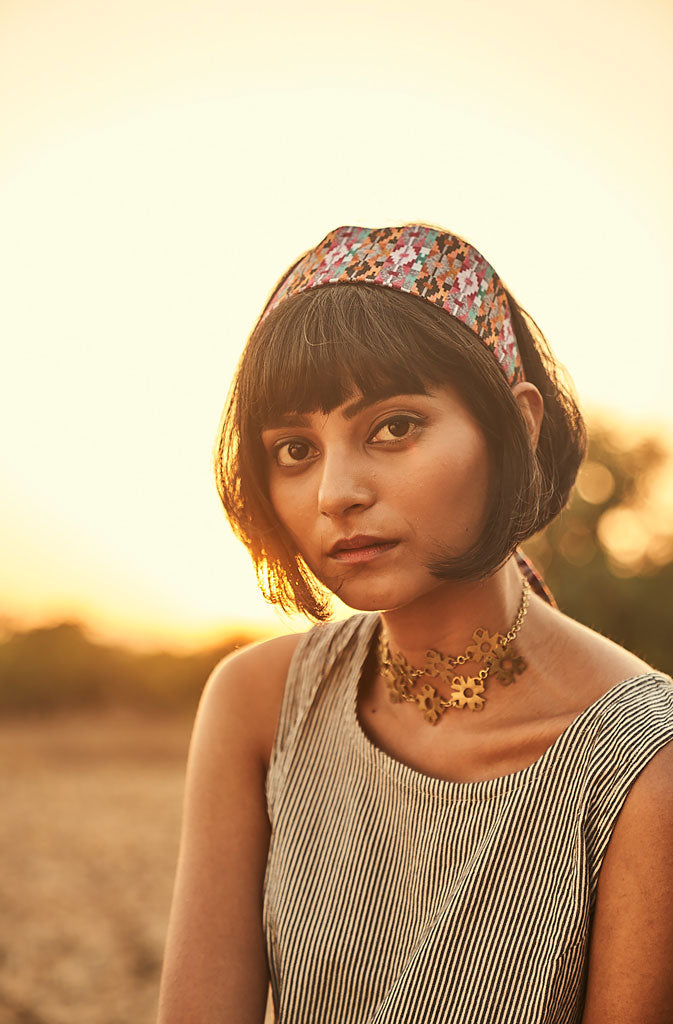 Festoon ChokerNecklaceThis piece is a reflection of the sanguineness and hope of its craftswomen through the festoon of flowers. Skilled artisans who are deaf and mute or survivors of humGlobalistinaFestoon ChokerGlobalistina