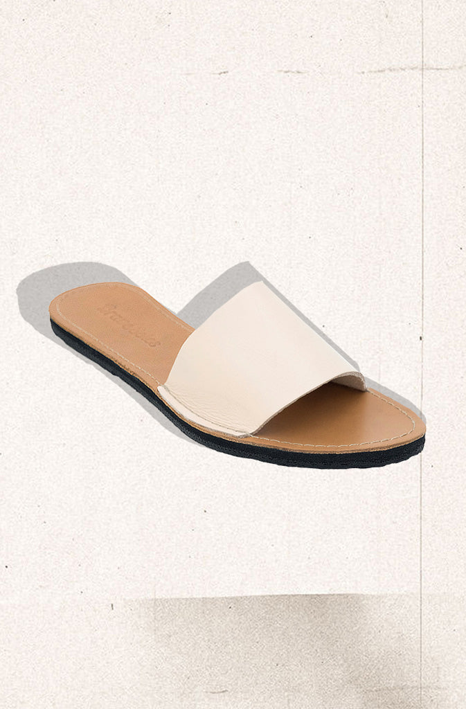 Linda Slide SandalsSandalsHandcrafted, simple and elegant leather slide sandal. Made with ethically sourced and fairly traded leather. Soles handmade from upcycled tires which sourced in the GlobalistinaLinda Slide SandalsGlobalistina