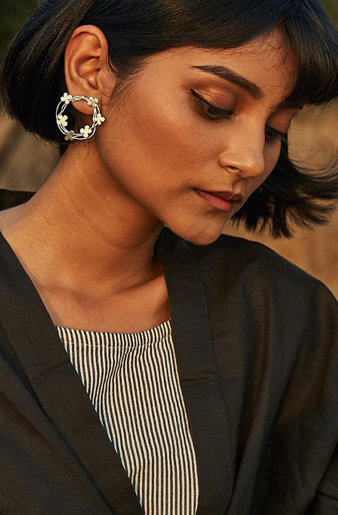 Small Coiled Hoops - SilverEarringsThese hooped earrings are from the collection “Deurali”, which typically means ''a pass between two valleys' and is a symbolic element of transition from one place tGlobalistinaSmall Coiled Hoops - SilverGlobalistina