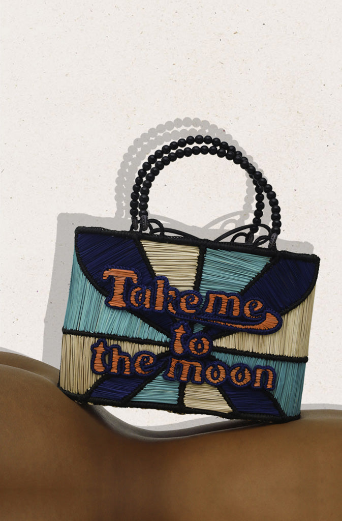 Take Me To The Moon HandbagHard Shaped BagQuirky bag with welded structure and 'Take me to the Moon' statement across the front. Inner lining in cotton fabric with a cord closing system to ensure your belongGlobalistinaMoon HandbagGlobalistina