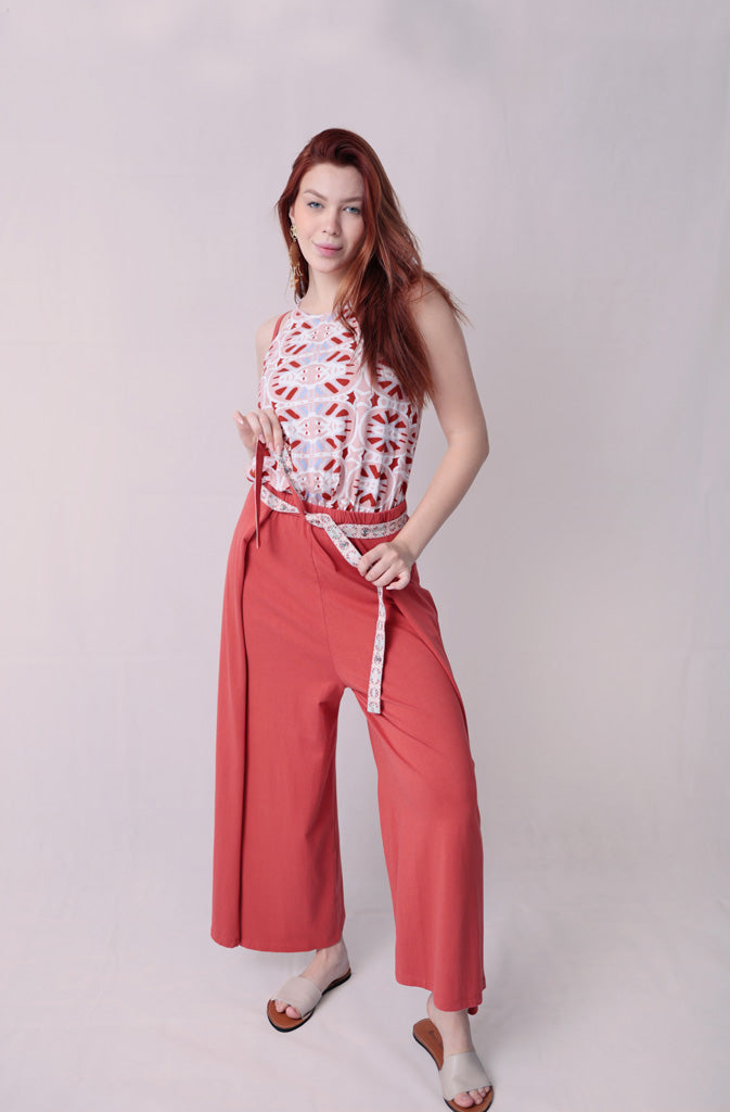 Kynuna Flare TrousersTrousersComfy brick red palazzo style culotte trousers with a dropped crotch. Ankle length with a wrap/cape design that accentuates the A-shape of the trousers and gently coGlobalistinaKynuna Flare TrousersGlobalistina