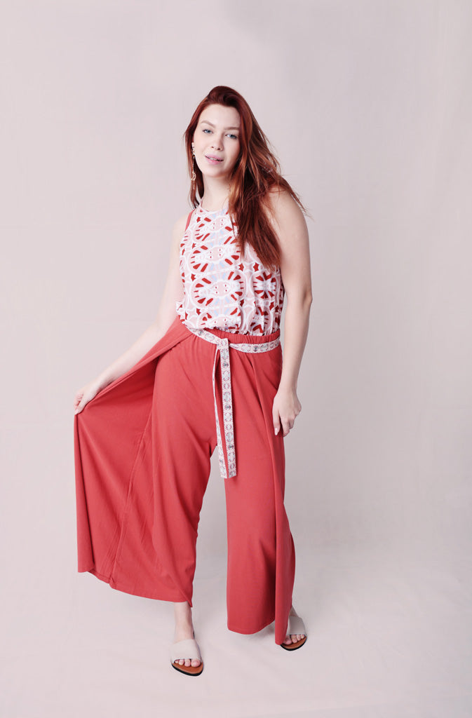 Kynuna Flare TrousersTrousersComfy brick red palazzo style culotte trousers with a dropped crotch. Ankle length with a wrap/cape design that accentuates the A-shape of the trousers and gently coGlobalistinaKynuna Flare TrousersGlobalistina