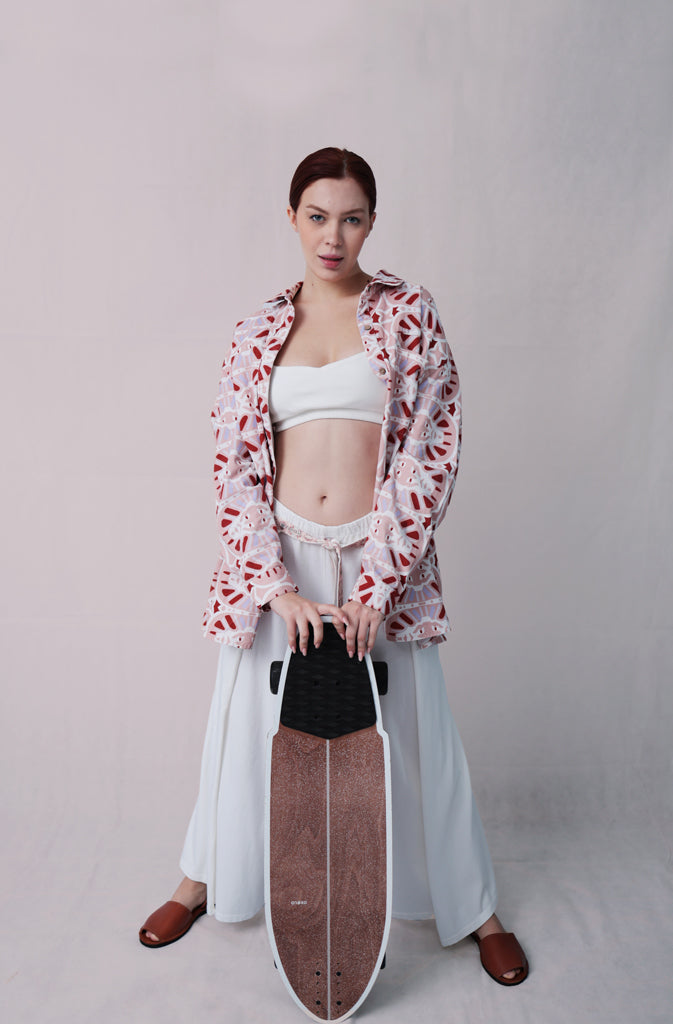 Kynuna Flare TrousersTrousersComfy brick red palazzo style culotte trousers with a dropped crotch. Ankle length with a wrap/cape design that accentuates the A-shape of the trousers and gently coGlobalistinaKynuna Flare TrousersGlobalistina