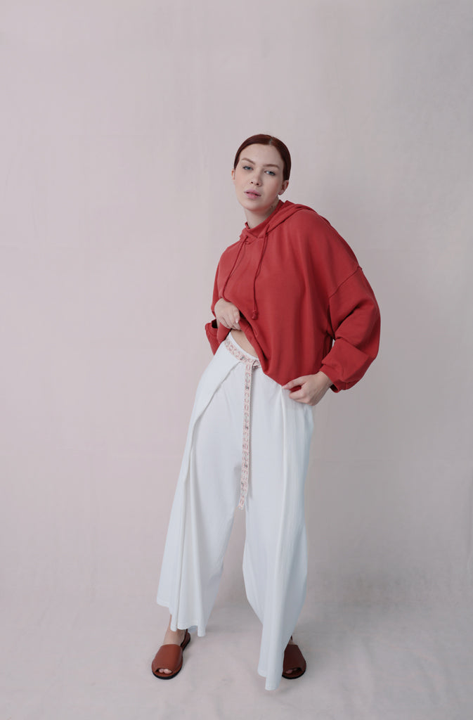 Kynuna Flare TrousersTrousersComfy brick red palazzo style culotte trousers with a dropped crotch. Ankle length with a wrap/cape design that accentuates the A-shape of the trousers and gently coGlobalistinaKynuna Flare TrousersGlobalistina