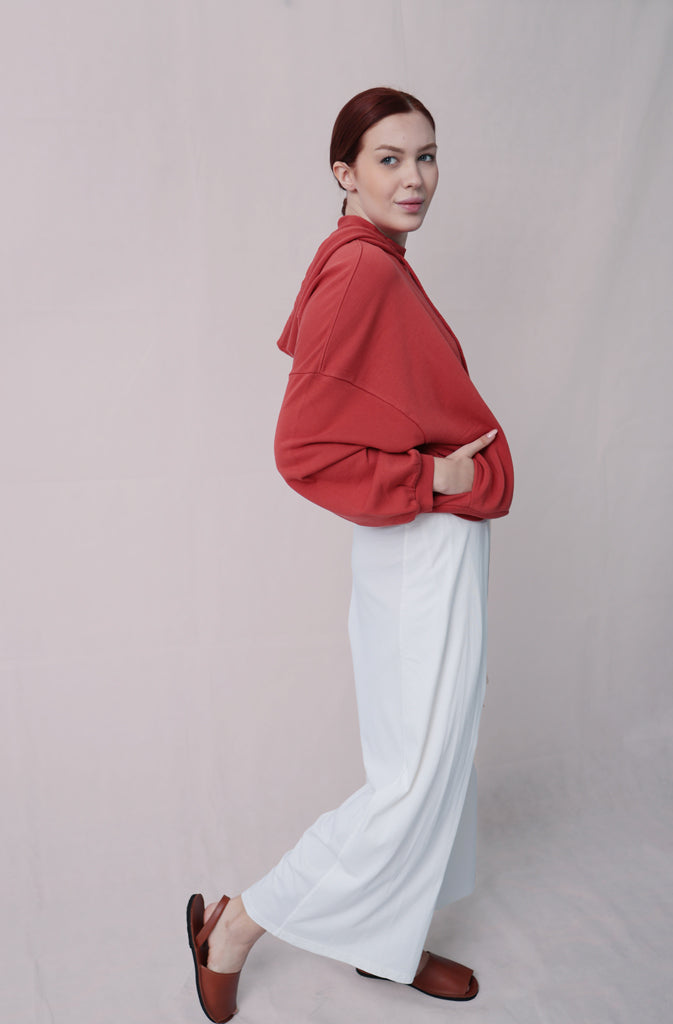 Kynuna Flare TrousersTrousersComfy brick red palazzo style culotte trousers with a dropped crotch. Ankle length with a wrap/cape design that accentuates the A-shape of the trousers and gently coGlobalistinaKynuna Flare TrousersGlobalistina