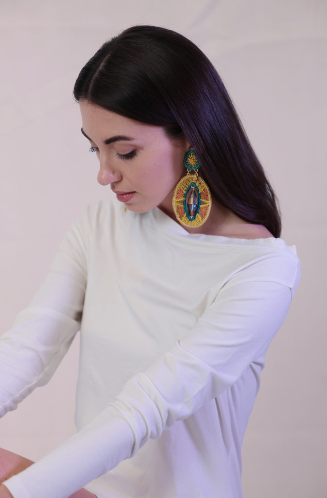 Solda TunicTopsThis sleek, long-sleeve tunic top features an off-the-shoulder design that accentuates your neckline and flatters the shoulders. The asymmetric bottom hem adds a touGlobalistinaSolda TunicGlobalistina