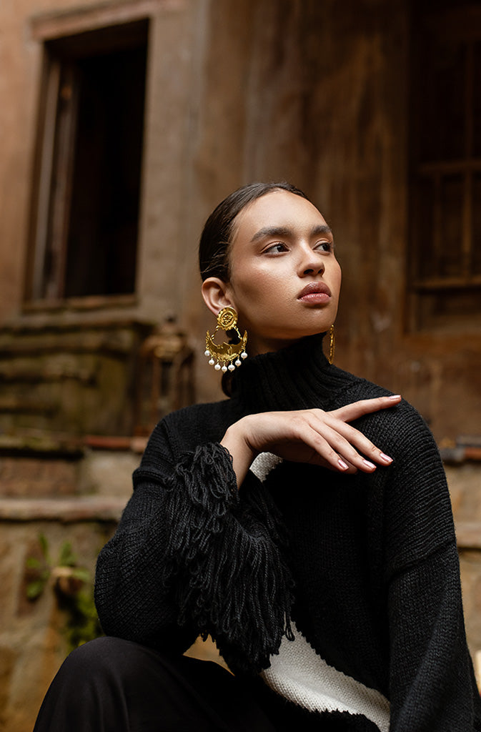 White Moon EarringsEarringsLarge clip-on earrings with the sun on the earlobe and a crescent moon with 7 pearls on each earring as the pendant. Engraved statement on the bottom edge 'She is blGlobalistinaWhite Moon EarringsGlobalistina